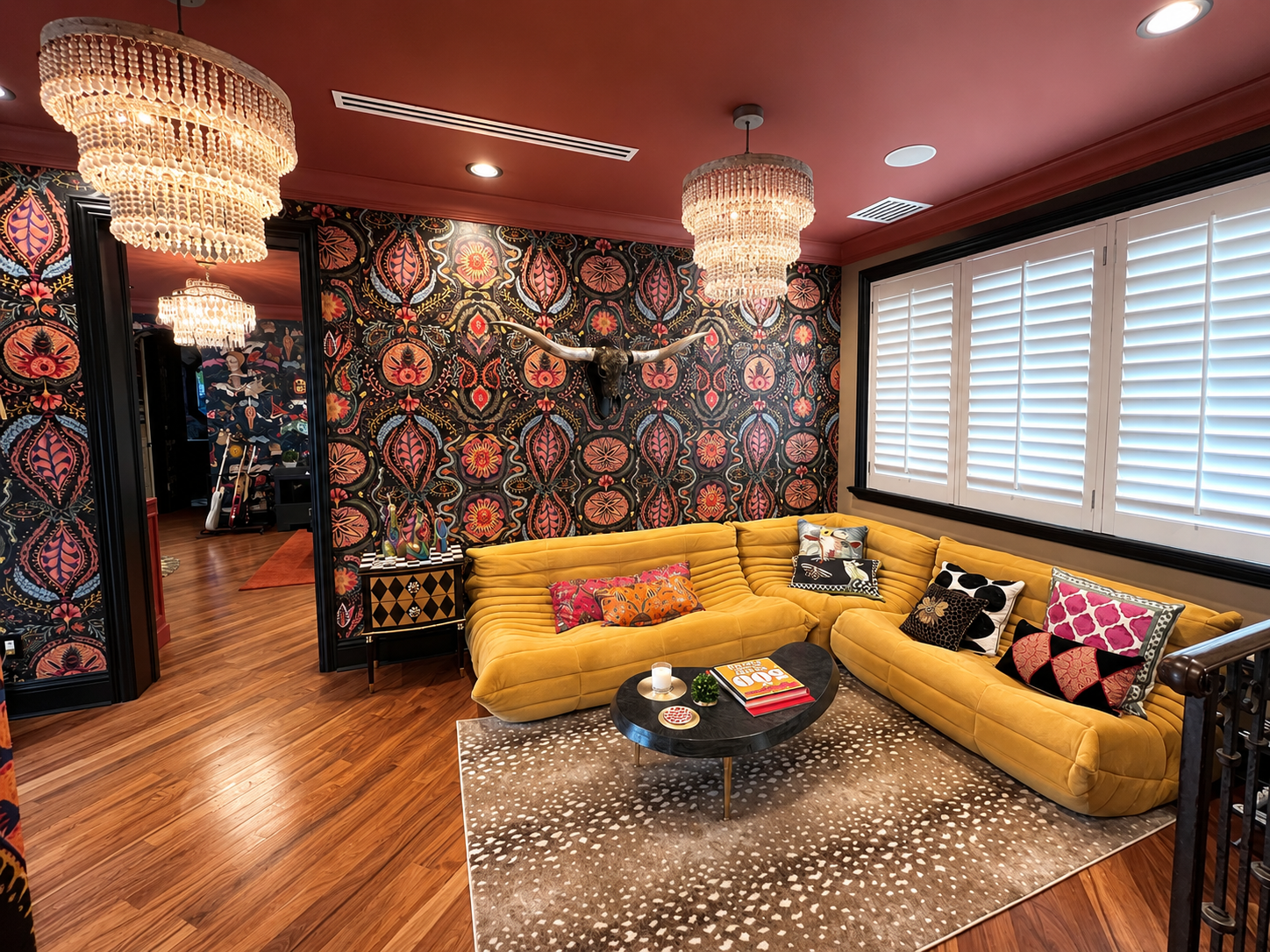 Maximalist daughter’s lounge with patterned wallpaper, coral ceiling, and sculptural yellow seating